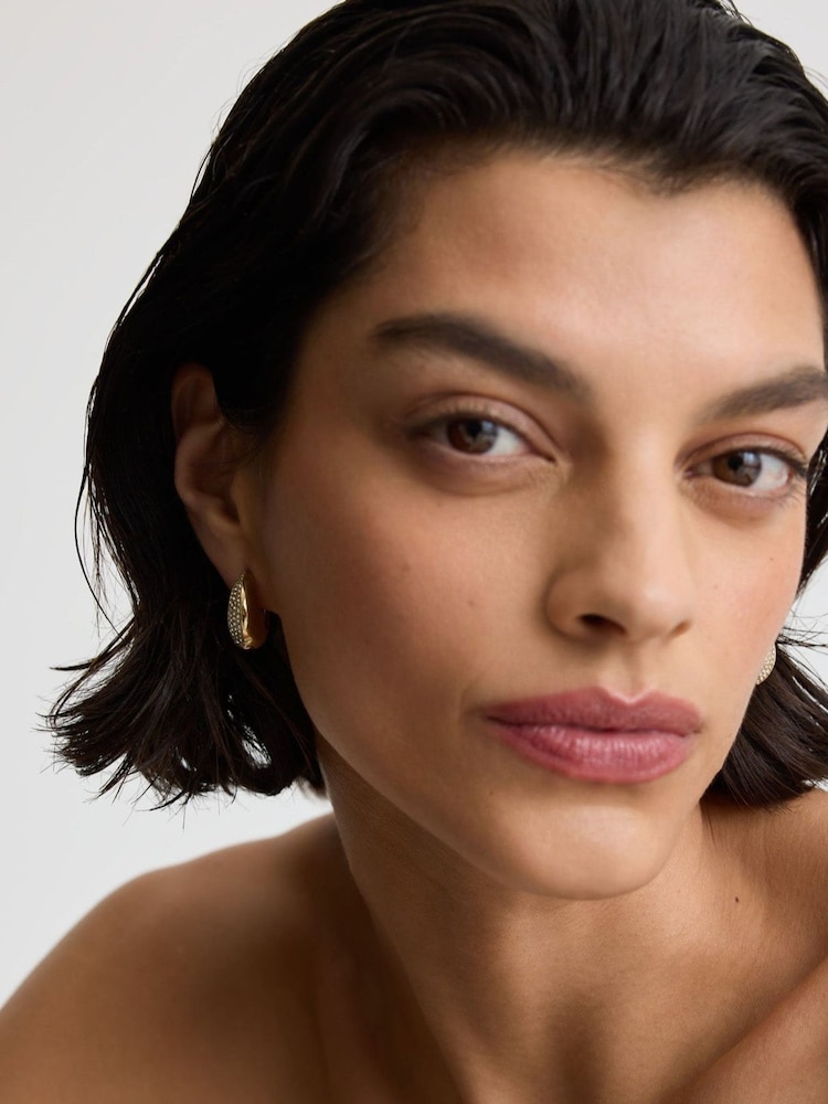 D.Louise Gold Tone Pavé Dome Huggies Earrings - Image 1 of 4