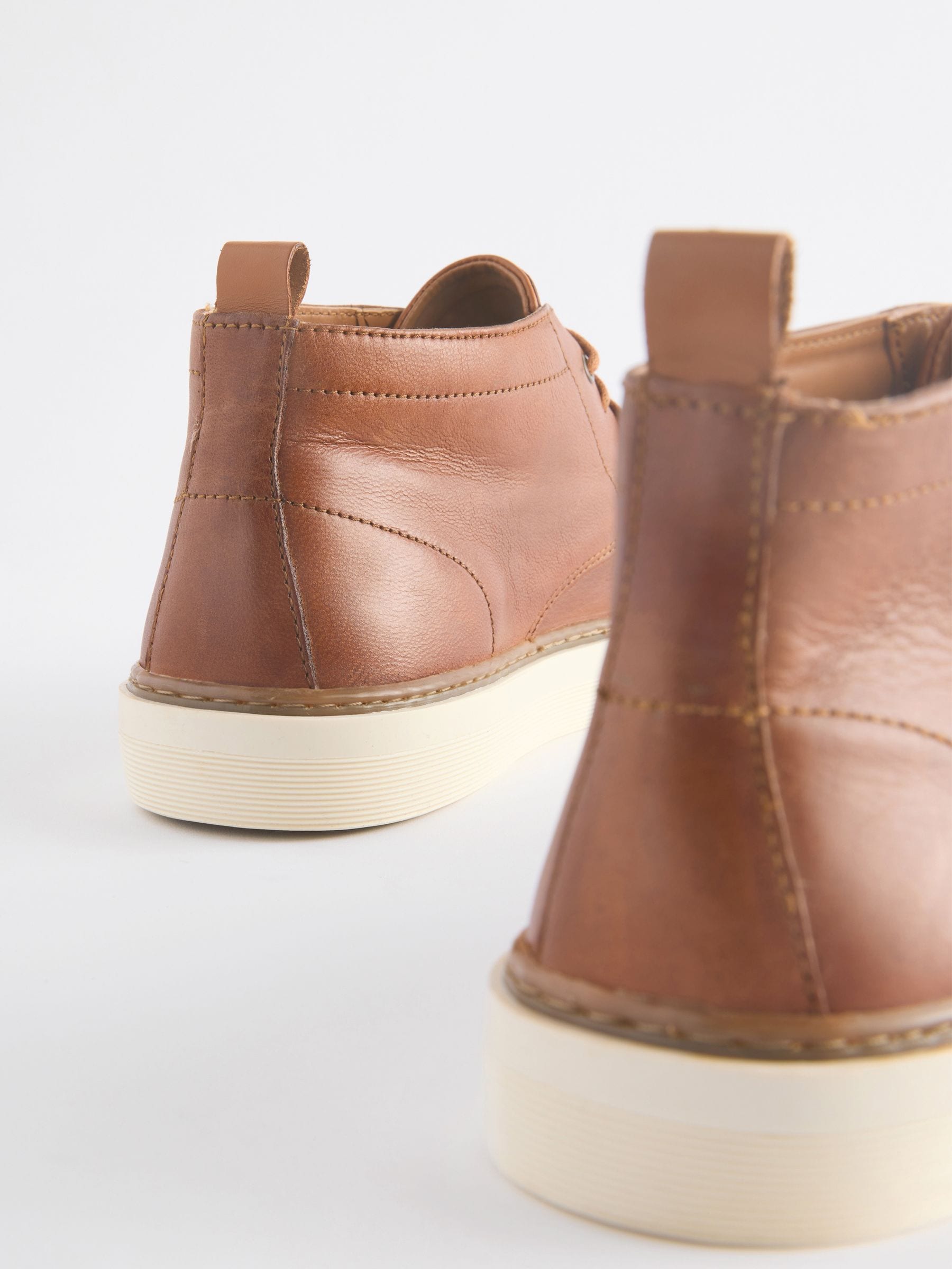 Tan boots white sole on sale