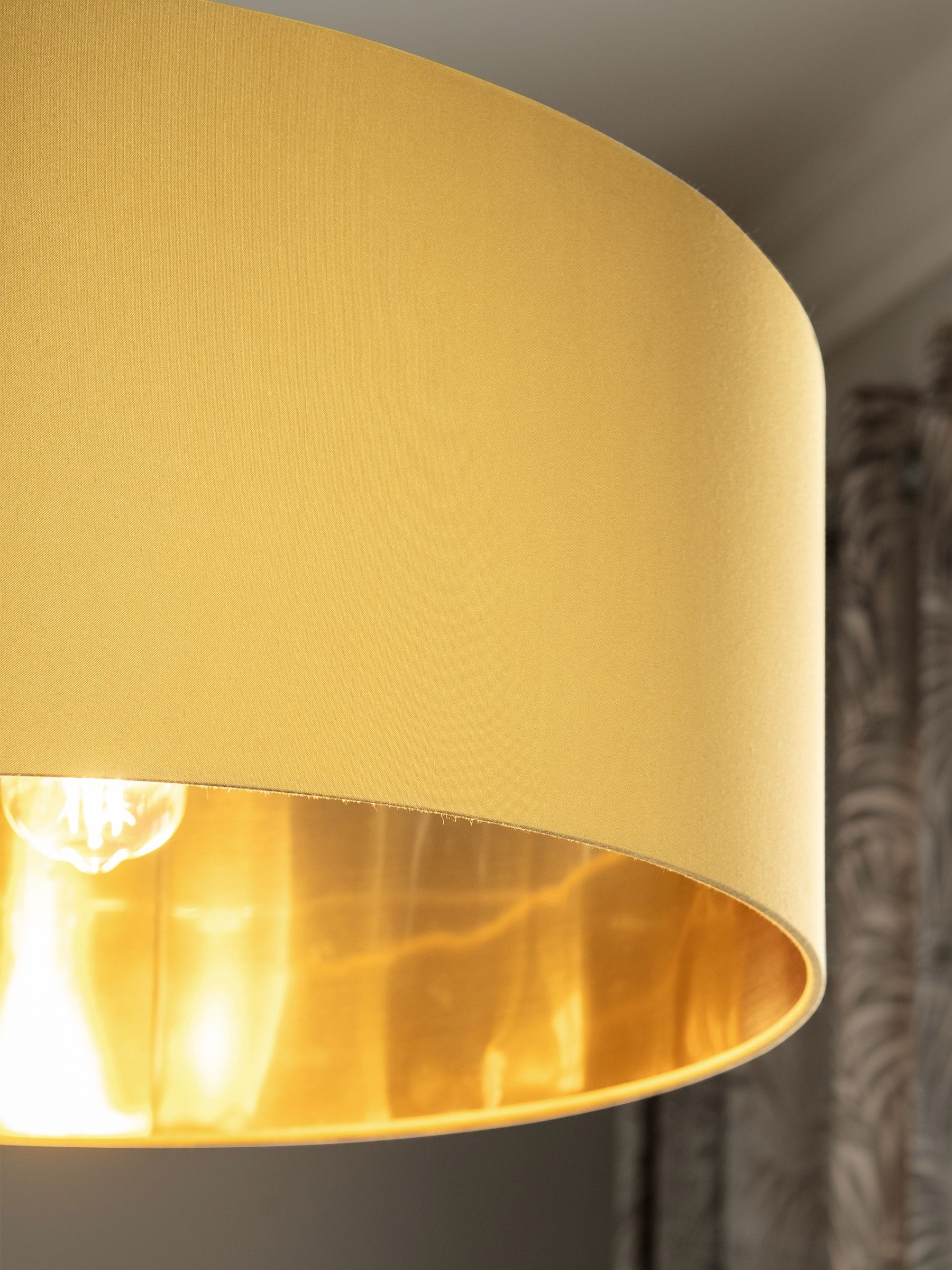 Ochre lamp shade next outlet