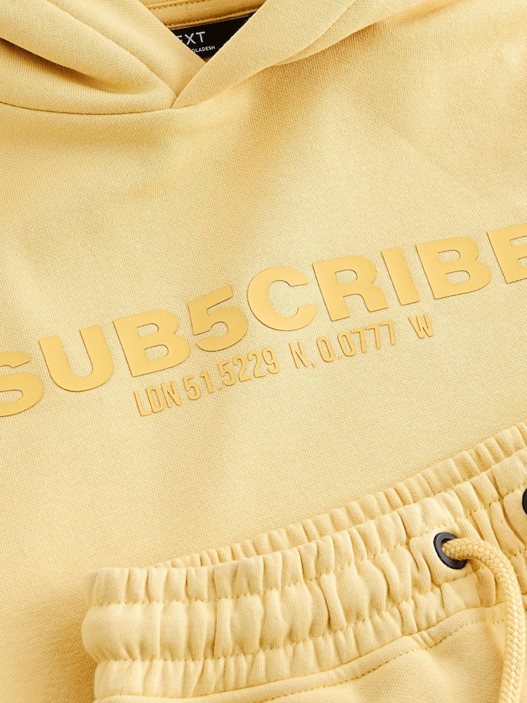 Buttermilch-Gelb - Set mit kurzärmeligem Kapuzensweatshirt und Shorts (3–16 Jahre) - Bild 6 von 6 Buttermilch-Gelb - Set mit kurzärmeligem Kapuzensweatshirt und Shorts (3–16 Jahre) - Bild 6 von 6