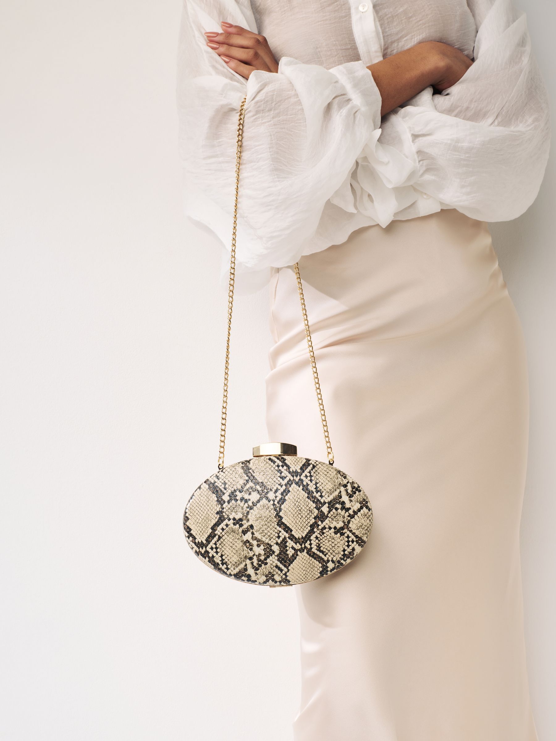 Snakeskin clutch bag on sale