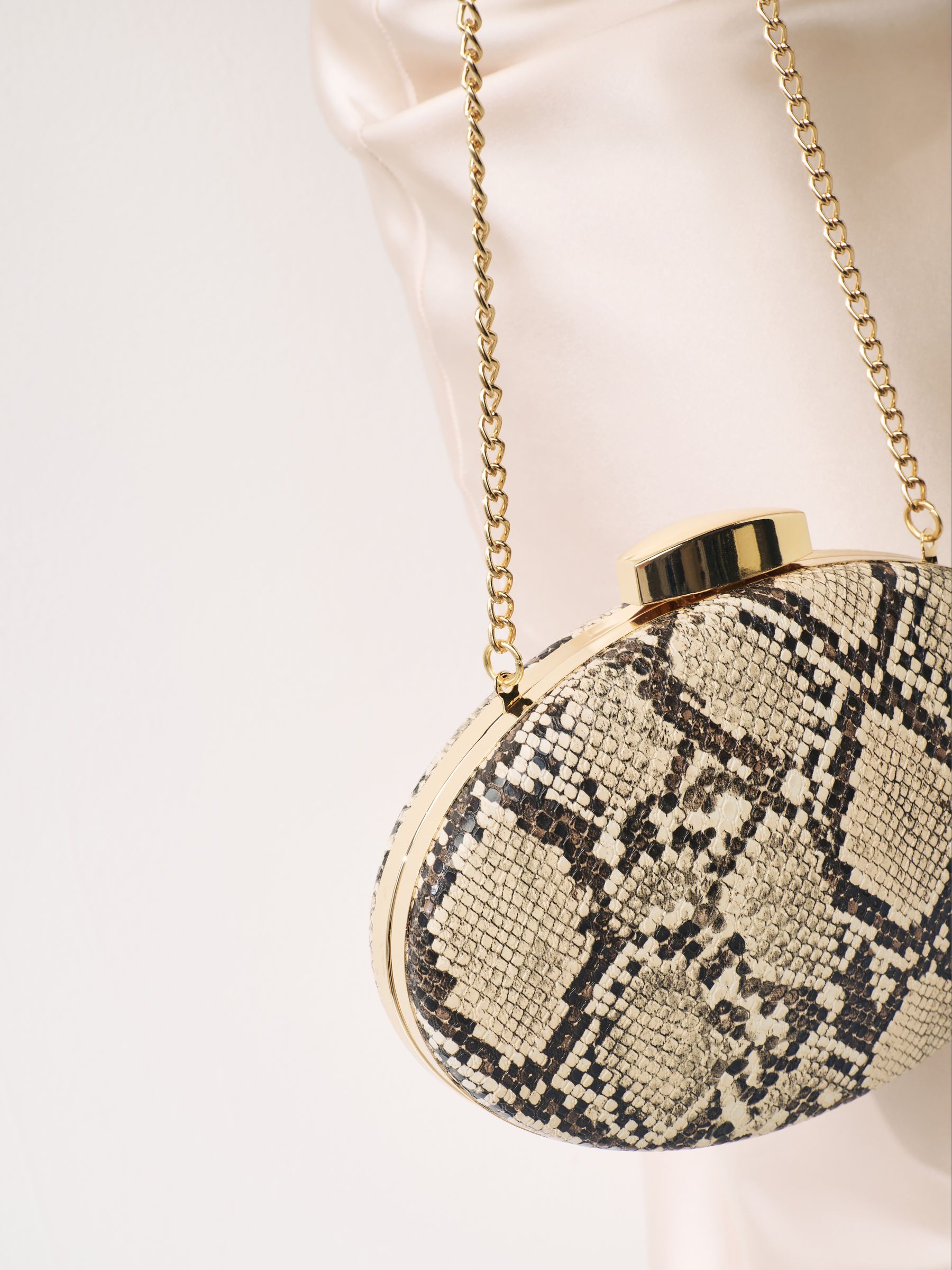 Gold snake print clutch bag outlet