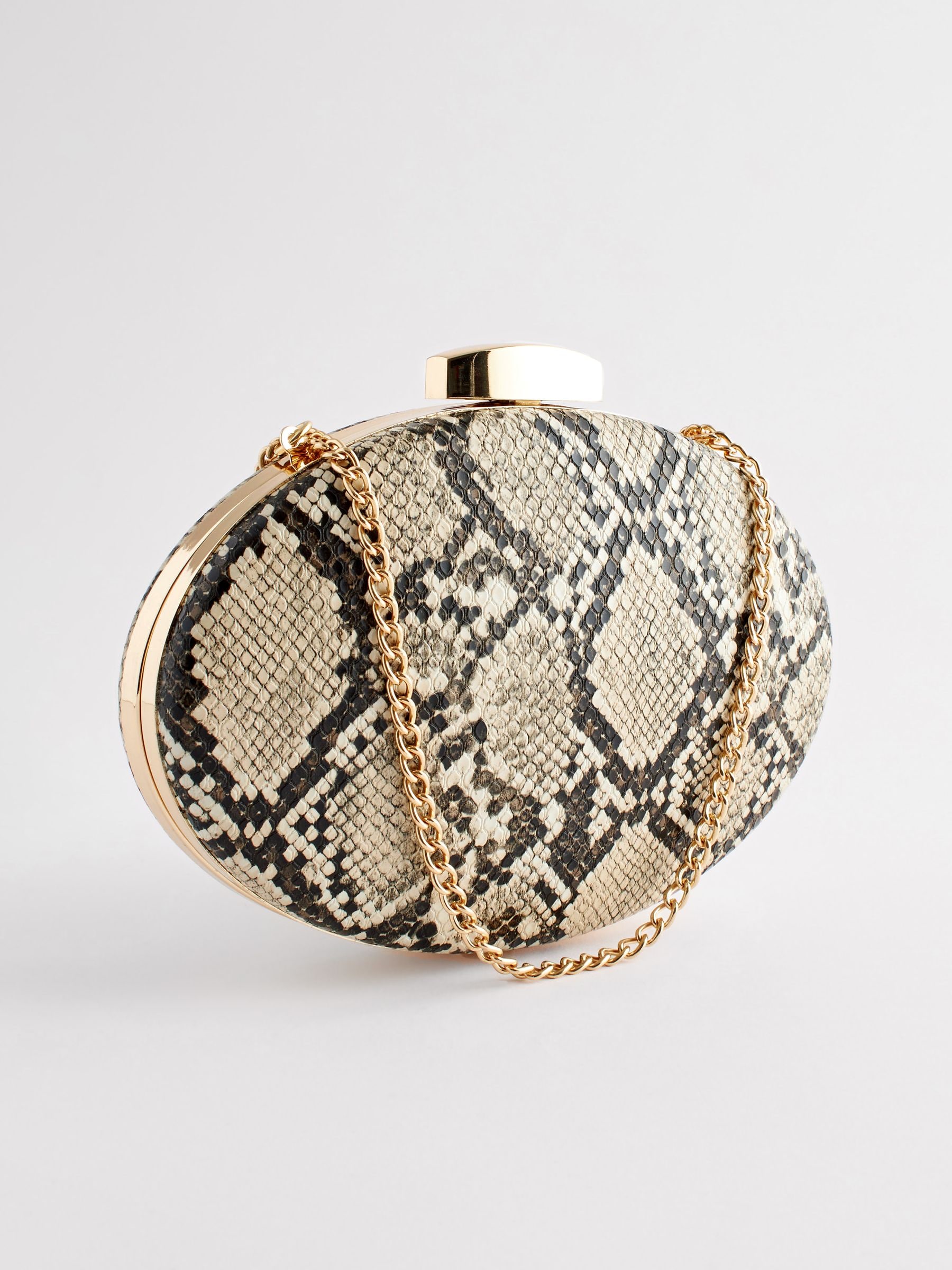 Buy Neutral Snake Print Boxy Oval Snap Clutch Bag from Next Luxembourg