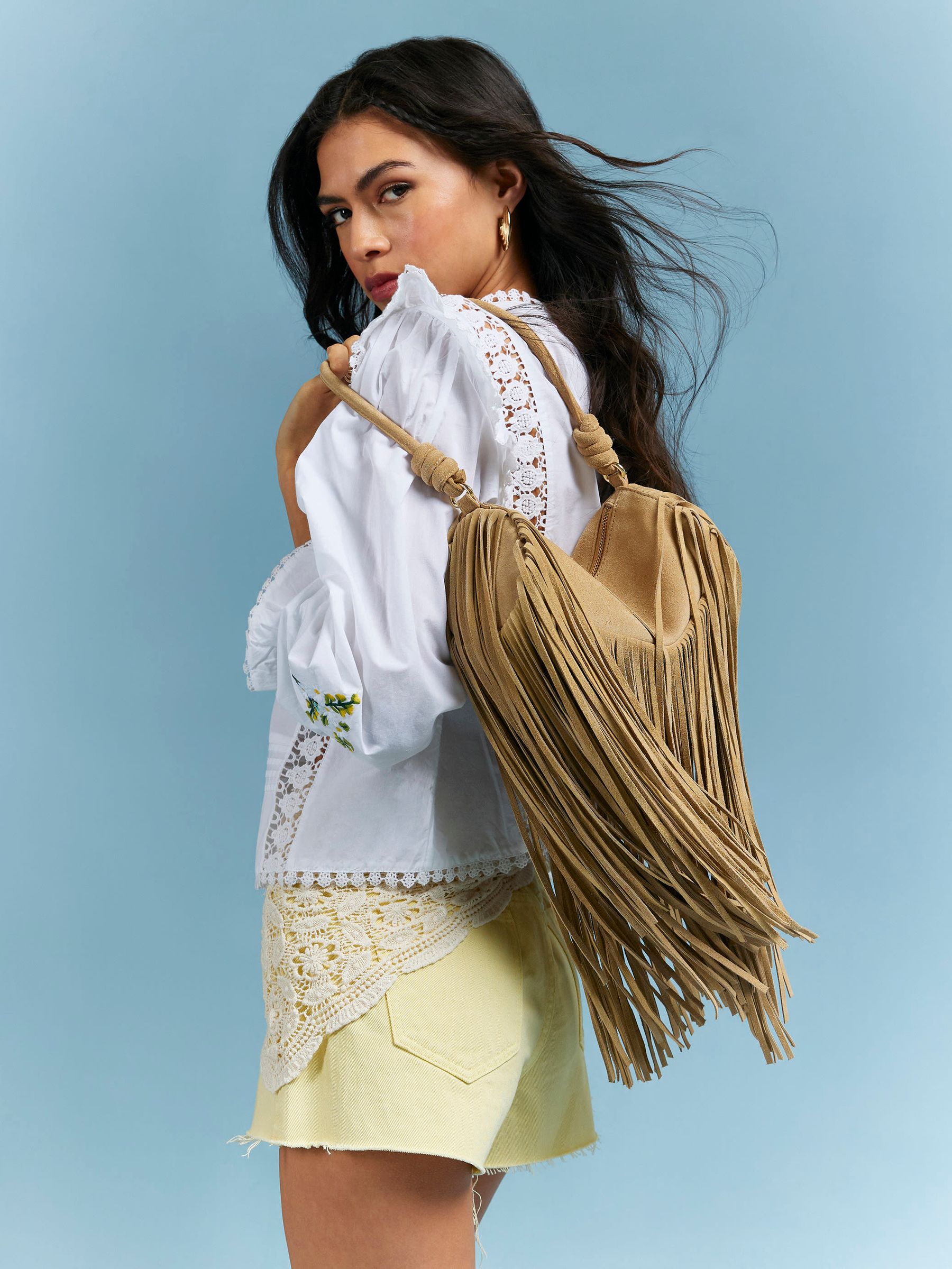 Buy River Island Brown Mega Fringe Suede Cylinder Bag from the