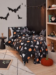Black Glow In The Dark Halloween Duvet Cover and Pillowcase Set - Image 1 of 5