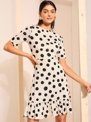 Friends Like These Black/White Print Short Sleeve Ruffle Hem Jersey Mini Dress - Image 1 of 5