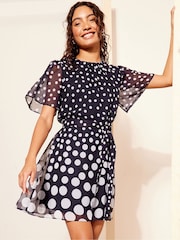 Friends Like These Navy Blue Petite Chiffon Flutter Sleeve with Self Tie Belt Dress - Image 1 of 4