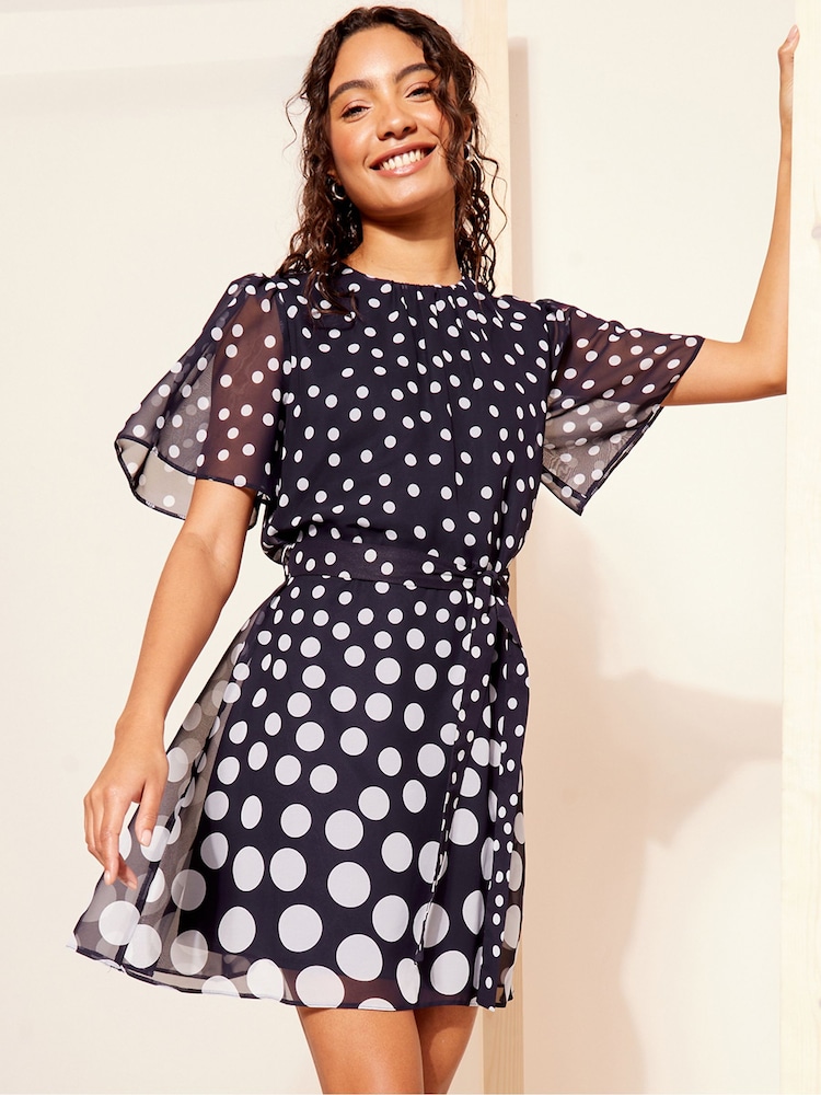 Friends Like These Navy Blue Petite Chiffon Flutter Sleeve with Self Tie Belt Dress - Image 1 of 4