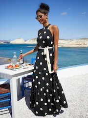 Friends Like These Black/White Halter Tiered Chiffon Tie Side Polka Dot Maxi Dress - Image 1 of 4