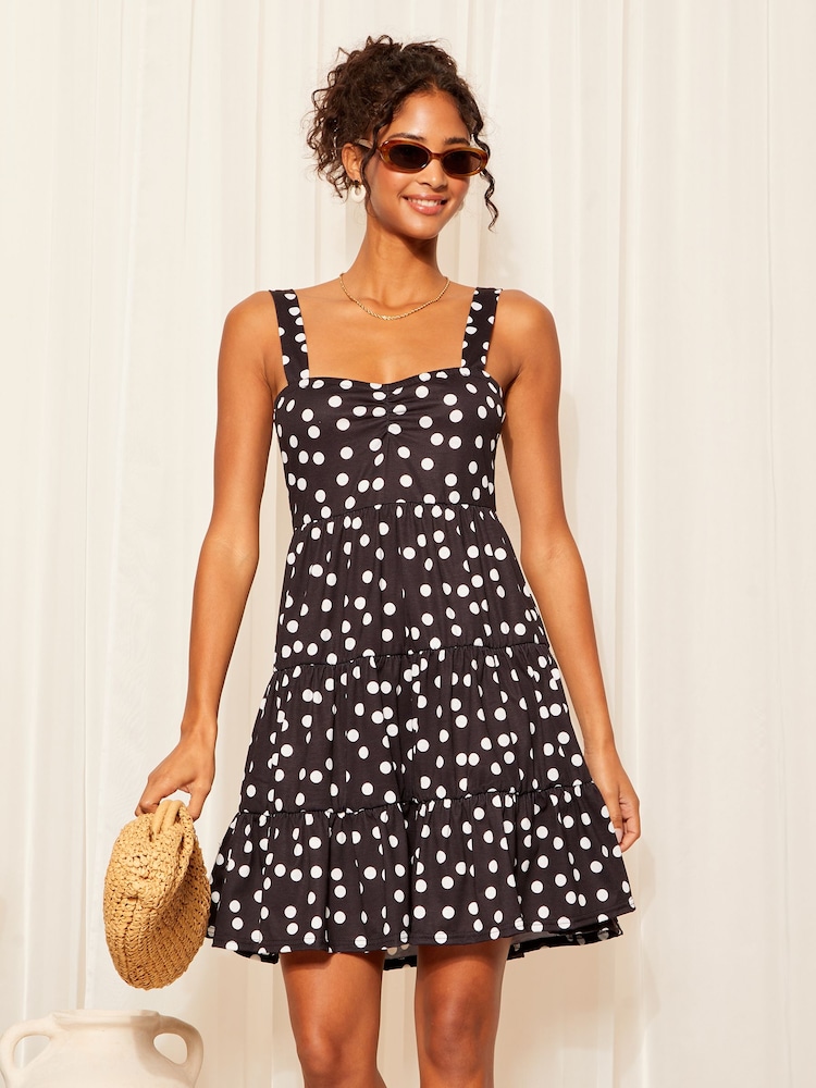 Friends Like These Black/White Polka Dot Strappy Tiered Mini Dress - Image 1 of 4 Friends Like These Black/White Polka Dot Strappy Tiered Mini Dress - Image 1 of 4