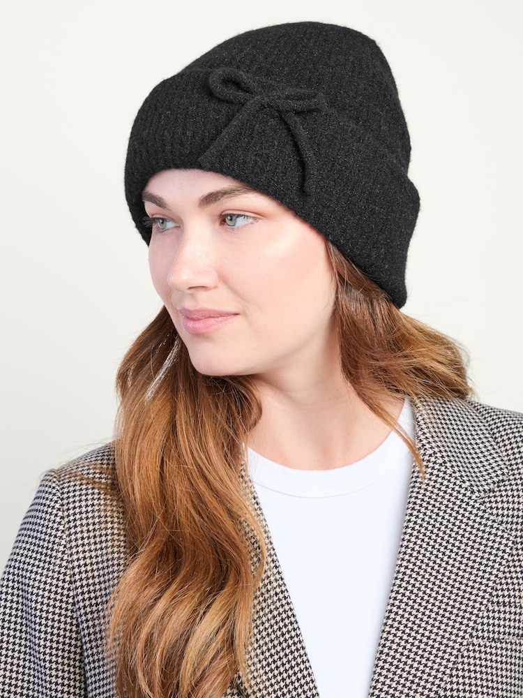 Totes Black Wool Blend Knitted Beanie Hat with Bow - Image 1 of 3 Totes Black Wool Blend Knitted Beanie Hat with Bow - Image 1 of 3
