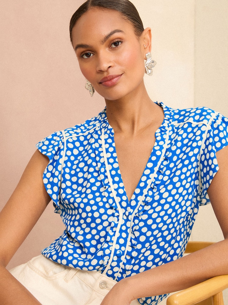 Love & Roses Blue Polka Dot Ruffle Trim V Neck Flutter Sleeve Blouse - Image 1 of 4