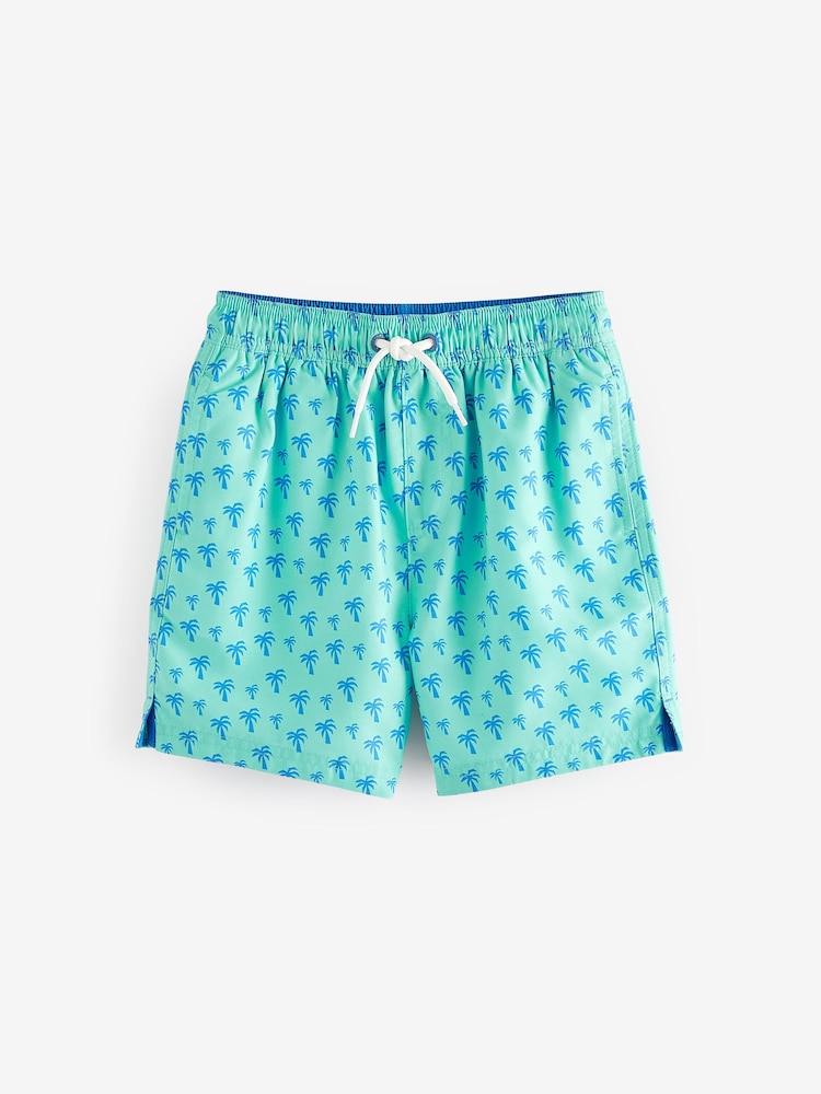 Mintgrün mit Palmenprint - Bedruckte Badeshorts (3–16 Jahre) - Bild 1 von 4