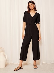Friends Like These Black Petite Puff Sleeve Zip Front Tie Waist Jumpsuit - Image 3 of 4