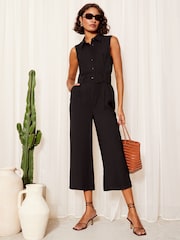 Friends Like These Black Sleeveless Utility Button Front Tie Waist Jumpsuit - Image 1 of 4