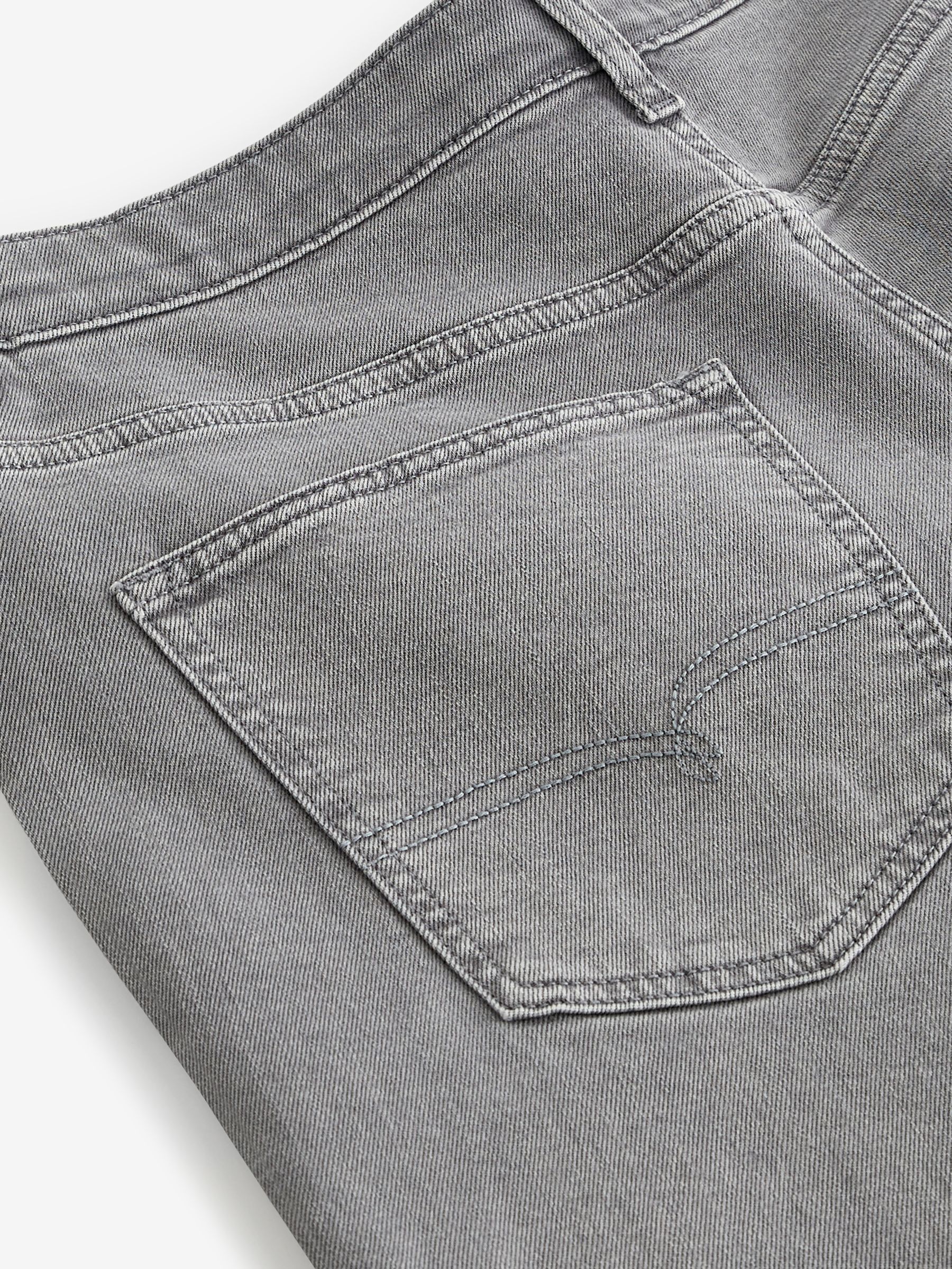Buy Grey Light Regular Fit Overdyed Denim Jeans from Next