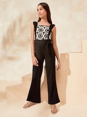 Schwarz/Weiß - Lipsy Jersey-Jumpsuit mit Häkeldesign (5–16 J.) - Bild 1 von 4
