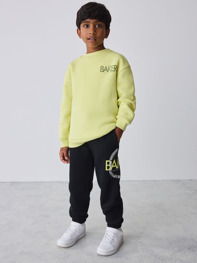 Baker by Ted Baker Lime Green 2 Piece Oversized Graphic Sweatshirt and Joggers Set - Image 1 of 16 Baker by Ted Baker Lime Green 2 Piece Oversized Graphic Sweatshirt and Joggers Set - Image 1 of 16