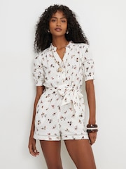 River Island Cream Short Sleeve Floral Print Textured Playsuit - Image 1 of 4