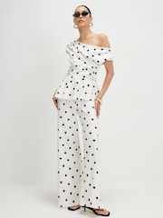 River Island Sleeveless Polka Dot Peplum Asymmetric Jumpsuit - Immagine 1 di 4
