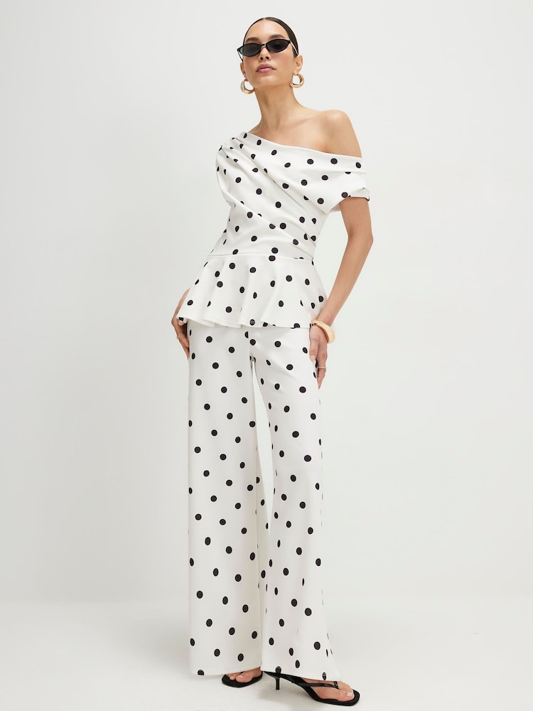 River Island Sleeveless Polka Dot Peplum Asymmetric Jumpsuit - Immagine 1 di 4 River Island Sleeveless Polka Dot Peplum Asymmetric Jumpsuit - Immagine 1 di 4