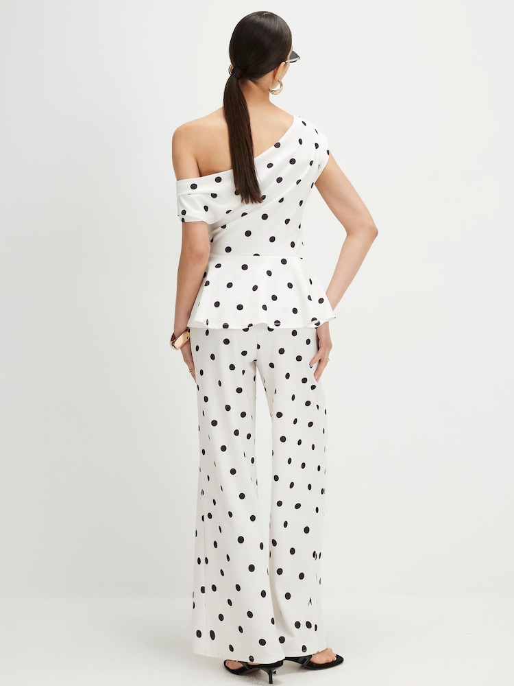 River Island Sleeveless Polka Dot Peplum Asymmetric Jumpsuit - Immagine 2 di 4 River Island Sleeveless Polka Dot Peplum Asymmetric Jumpsuit - Immagine 2 di 4