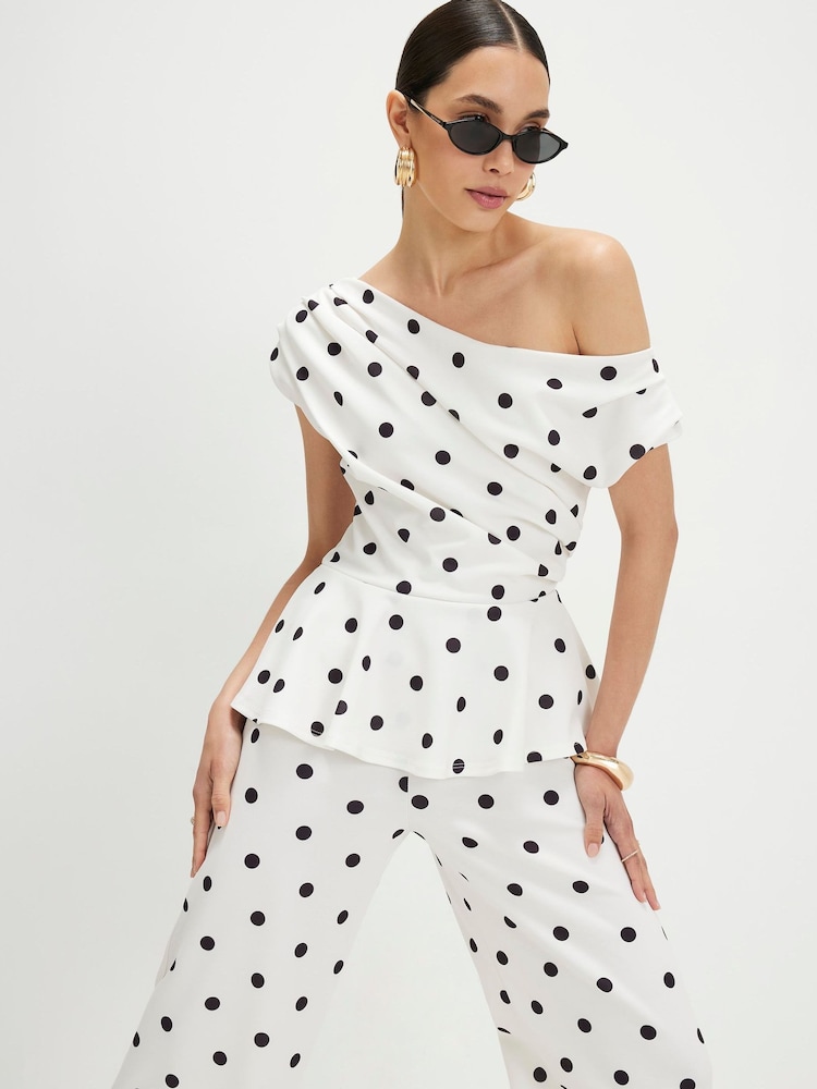 River Island Sleeveless Polka Dot Peplum Asymmetric Jumpsuit - Immagine 4 di 4 River Island Sleeveless Polka Dot Peplum Asymmetric Jumpsuit - Immagine 4 di 4