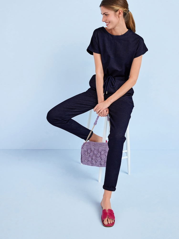 Rinse Blue Tie Waist Short Sleeve Jersey Denim Jumpsuit - Image 1 of 5 Rinse Blue Tie Waist Short Sleeve Jersey Denim Jumpsuit - Image 1 of 5