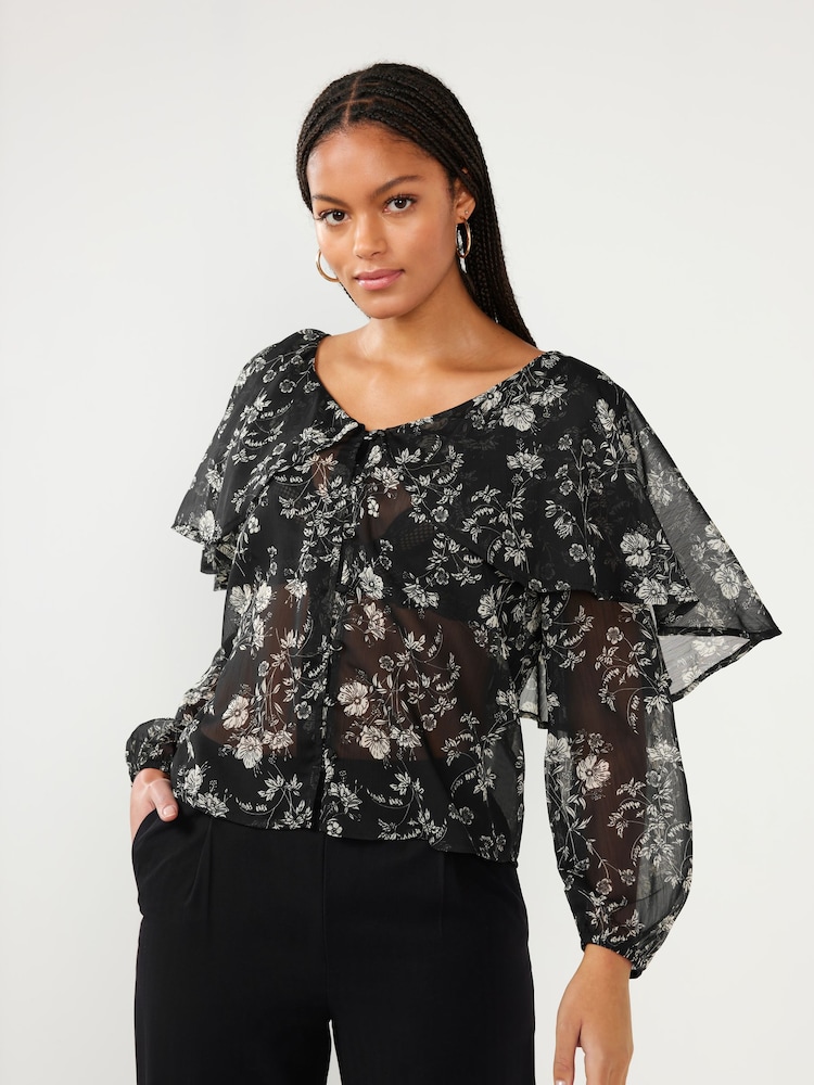 Blümchenmuster, Schwarz - Cape Langarmbluse - Bild 1 von 5 Blümchenmuster, Schwarz - Cape Langarmbluse - Bild 1 von 5