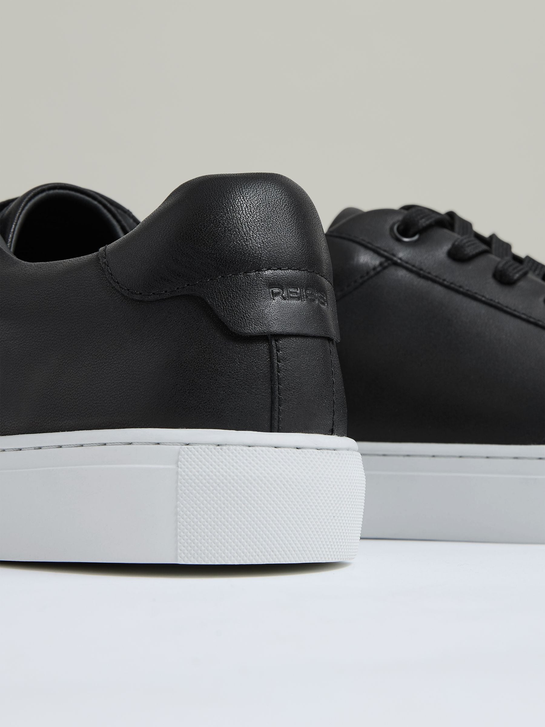 Buy Reiss Black Ashley Leather Low Top Trainers from Next Belgium