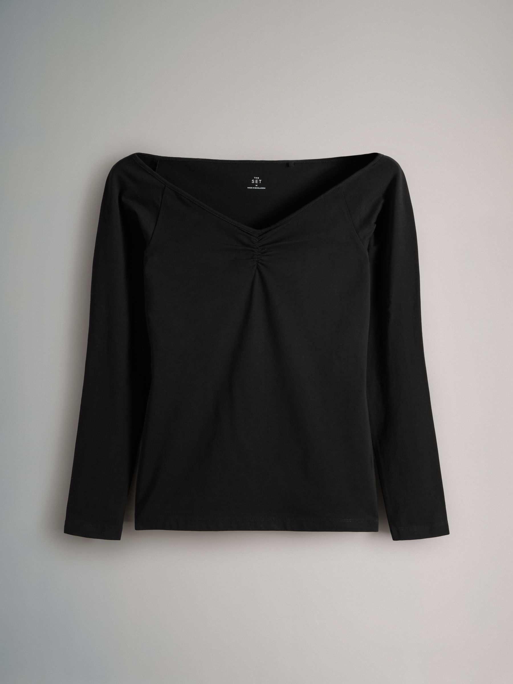 black v neck off the shoulder top