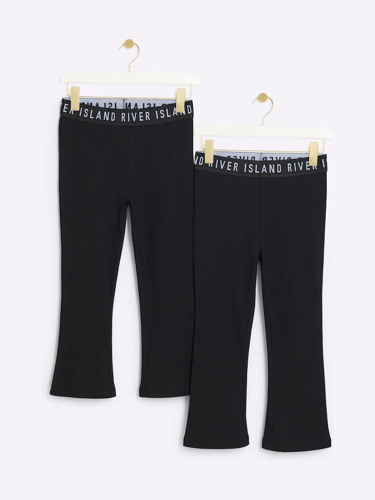 River Island Black Girls Rib Kickflare 100% Cotton Trousers 2 Pack - Image 1 of 4 River Island Black Girls Rib Kickflare 100% Cotton Trousers 2 Pack - Image 1 of 4