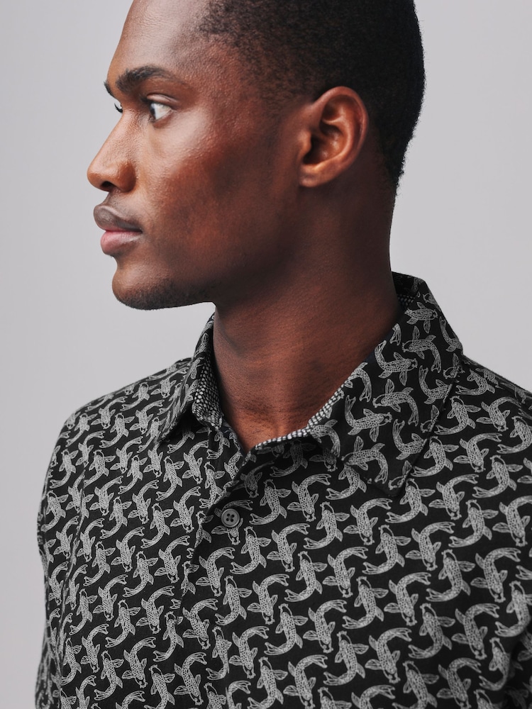Fische, Schwarz - Kurzärmeliges Polo-Shirt mit Print - Bild 1 von 8 Fische, Schwarz - Kurzärmeliges Polo-Shirt mit Print - Bild 1 von 8