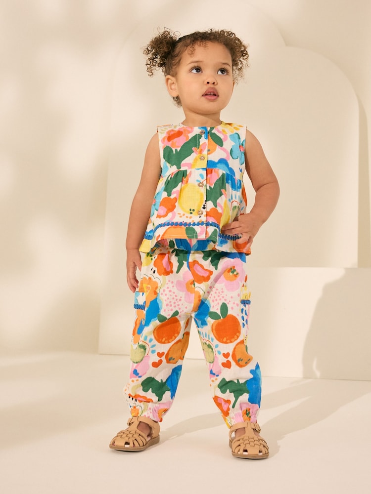 Regenbogenfarben - Set aus hellem Oberteil und Hose aus 100 % Baumwolle (3M.–7J.) - Bild 1 von 9 Regenbogenfarben - Set aus hellem Oberteil und Hose aus 100 % Baumwolle (3M.–7J.) - Bild 1 von 9