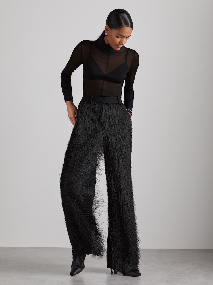 Schwarz - Reiss, Danni Atelier, Krepp-Hose mit Fransen - Bild 1 von 7 Schwarz - Reiss, Danni Atelier, Krepp-Hose mit Fransen - Bild 1 von 7
