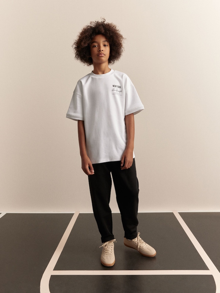 White/Black Short Sleeve T-Shirt and Joggers Set (3-16yrs) - Image 1 of 9