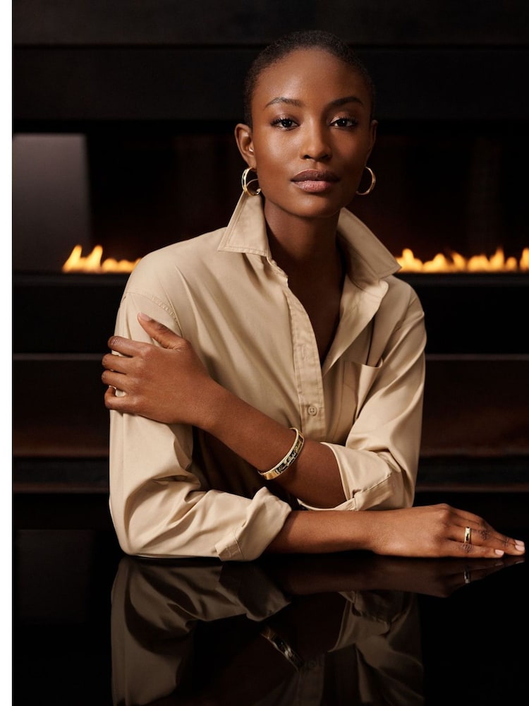 Lauren Ralph Lauren Gold Tone Script Logo Bangle - Image 1 of 1 Lauren Ralph Lauren Gold Tone Script Logo Bangle - Image 1 of 1