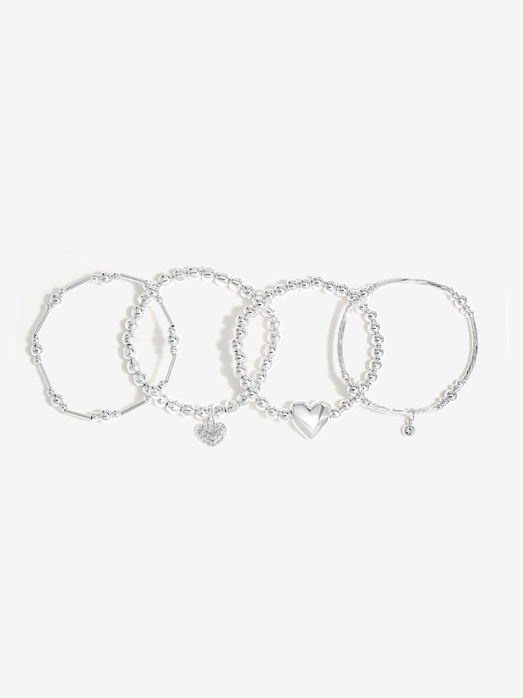 Pack de 4 pulseras elásticas con colgante de bola corazón pulido en tonos de Mood - Imagen 1 de 3