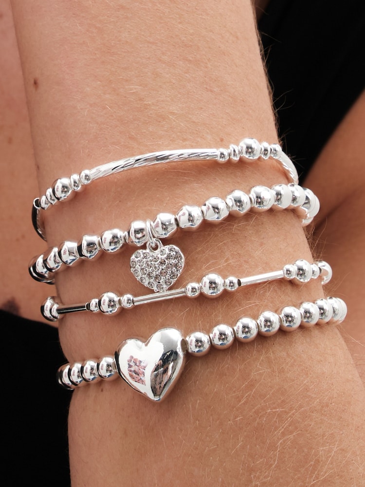 Pack de 4 pulseras elásticas con colgante de bola corazón pulido en tonos de Mood - Imagen 2 de 3