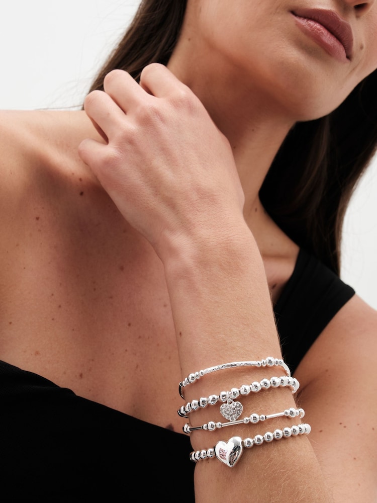 Pack de 4 pulseras elásticas con colgante de bola corazón pulido en tonos de Mood - Imagen 3 de 3