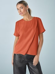 Naranja quemado - Short Sleeve Crepe Asymmetric Top - Imagen 1 de 7