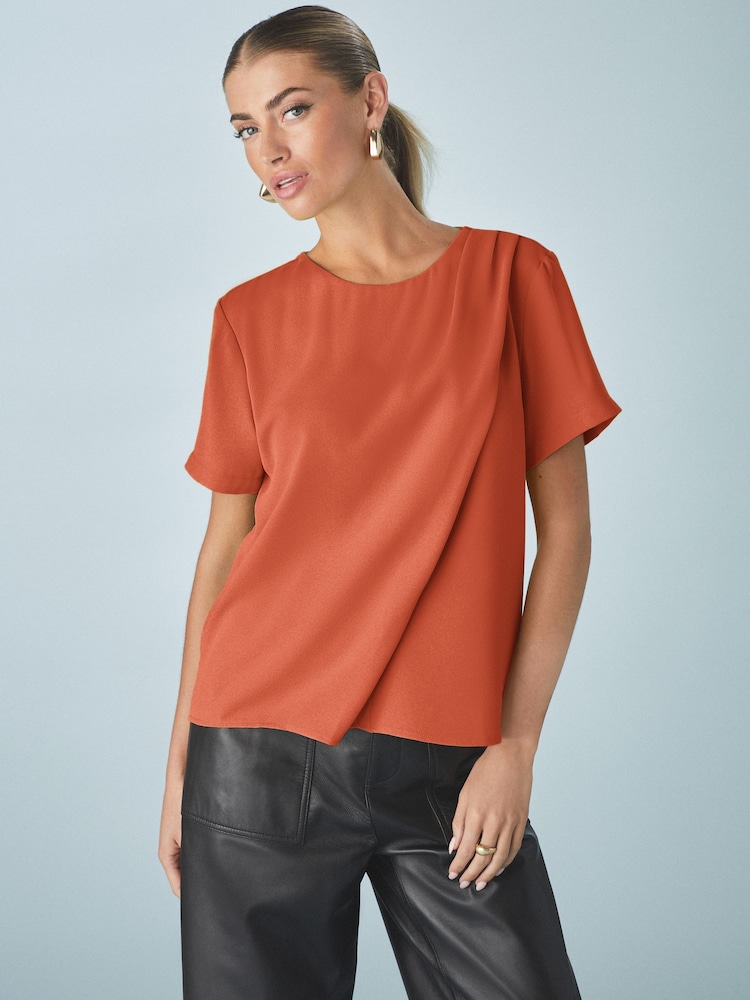 Naranja quemado - Short Sleeve Crepe Asymmetric Top - Imagen 1 de 7