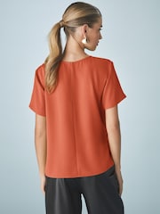Naranja quemado - Short Sleeve Crepe Asymmetric Top - Imagen 3 de 7