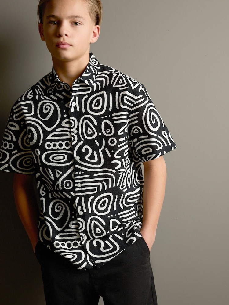 Black/White Swirl AOP Short Sleeve Printed Shirt (3-16yrs) - Image 1 of 9 Black/White Swirl AOP Short Sleeve Printed Shirt (3-16yrs) - Image 1 of 9