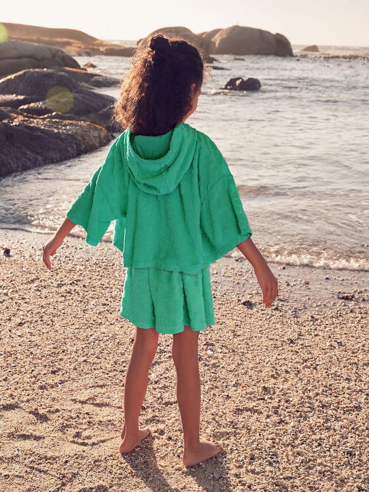 Zelena z rožami - Brisača za na plažo Co-Ord kapucar; Komplet jopa/pulover s kapuco in kratkih hlač (3-16let) - Slika 2 iz 7 Zelena z rožami - Brisača za na plažo Co-Ord kapucar; Komplet jopa/pulover s kapuco in kratkih hlač (3-16let) - Slika 2 iz 7