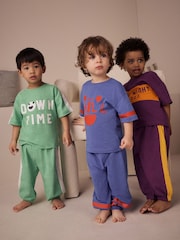 Mehrfarbiger leuchtender Schriftzug - Pyjamas mit langen Beinen und Kurzarm in entspannter Passform, 3er-Pack (9M.–10J.) - Bild 1 von 4