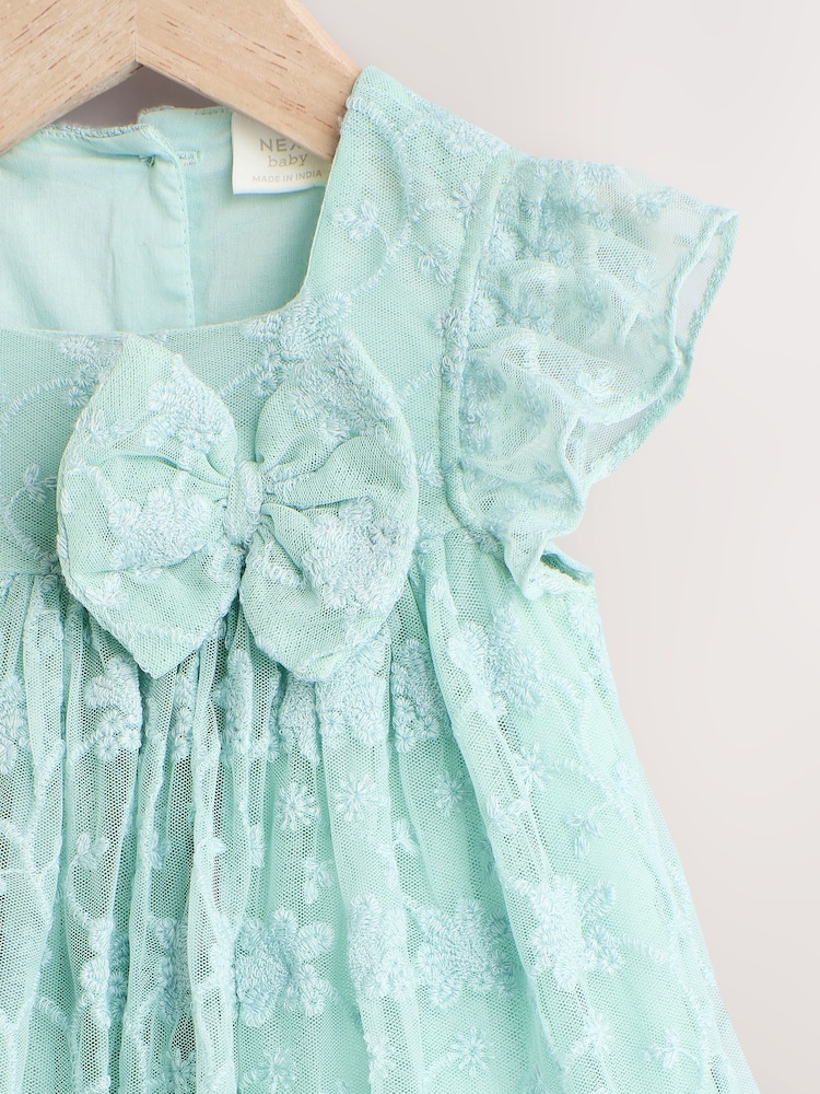 Sage Green Broderie Mesh Bow Baby Dress (0mths-2yrs) - Image 5 of 6