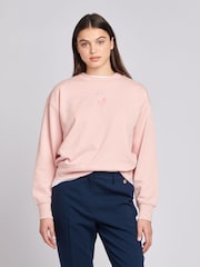 من U.S. Polo Assn. سويت شيرت نسائي كبير وردي بتصميم خيّال مزدوج - صورة 1 من 7