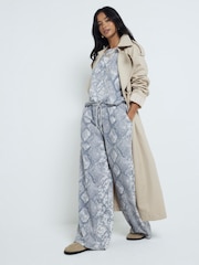 River Island миниатюрные спортивные брюки со змеиным принтом 100% хлопка - Изображение 1 из 4