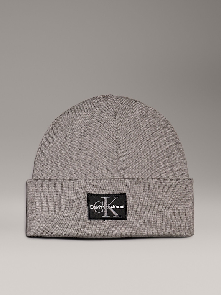 Calvin Klein Grey Logo Patch Warm Beanie - Image 1 of 5 Calvin Klein Grey Logo Patch Warm Beanie - Image 1 of 5